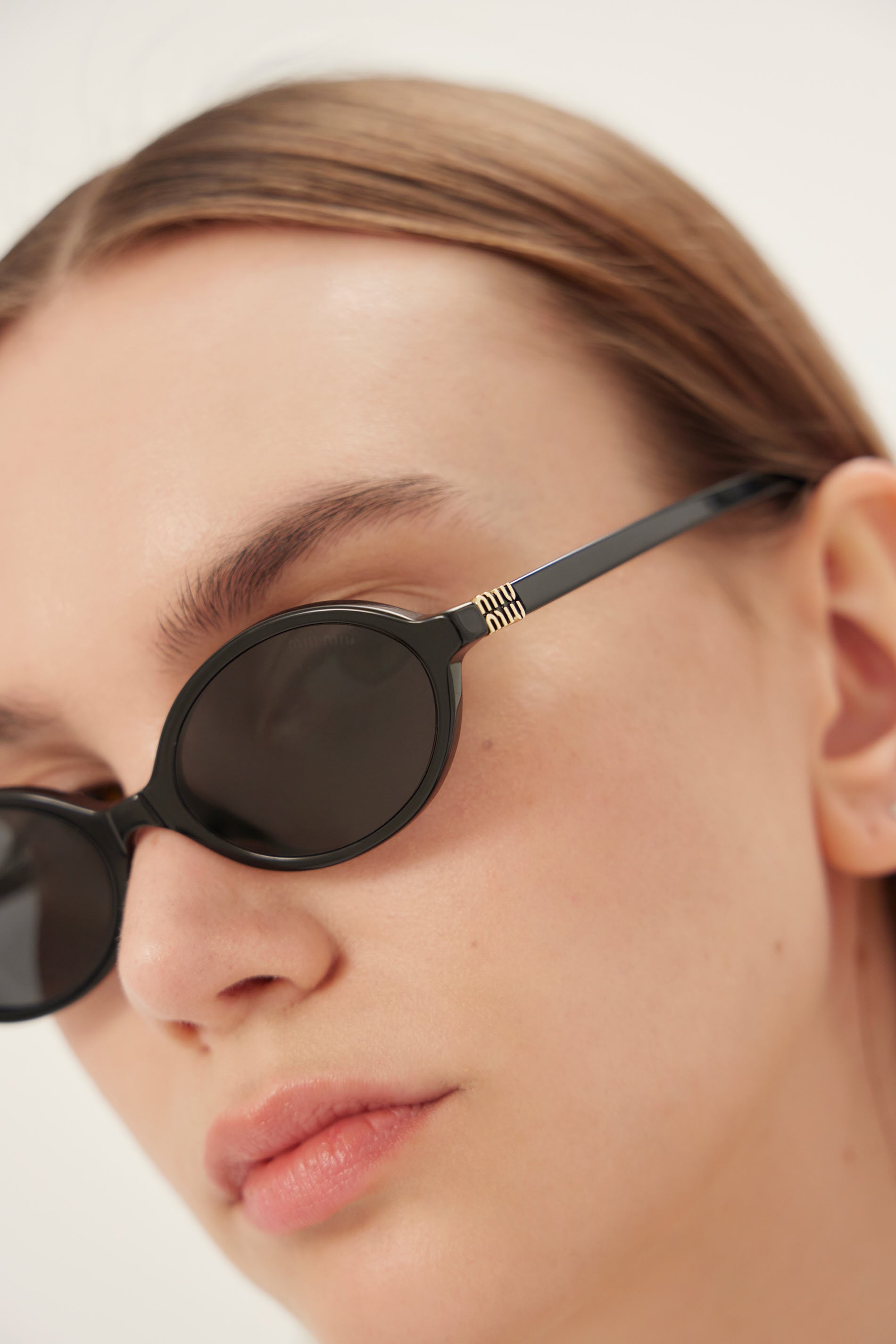 Miu Miu oval acetate black sunglasses