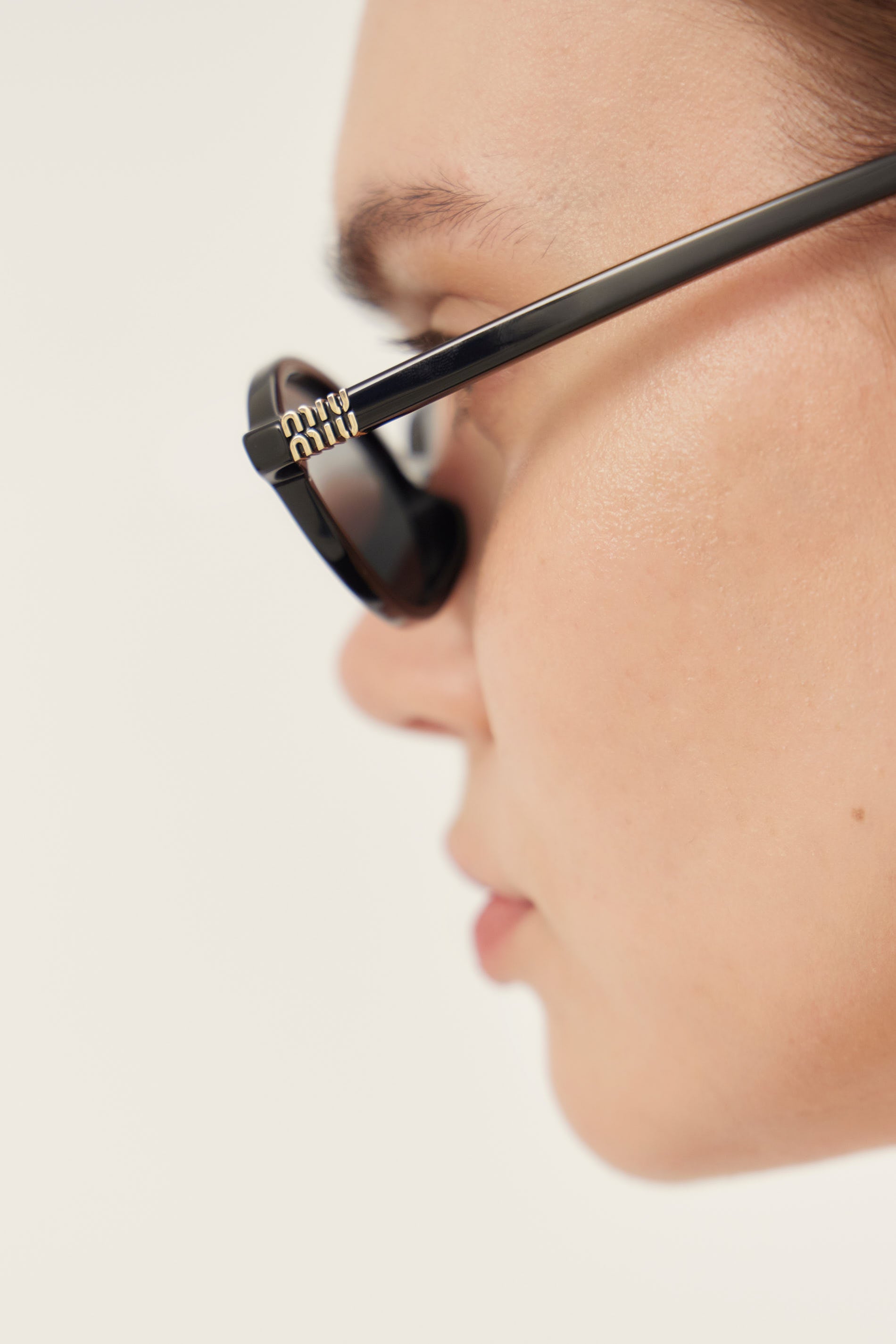 Miu Miu oval acetate black sunglasses